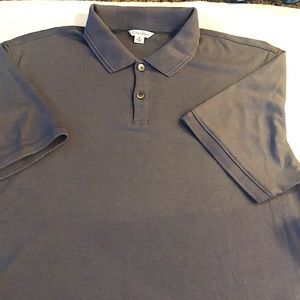 Men’s Calvin Klein polo style golf shirt with 2 buttons. Size M
